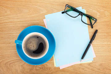 Blank lined paper with coffee, office supplies and glasses