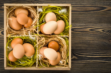 Raw eggs on a wooden table