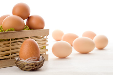 Raw eggs on a white table