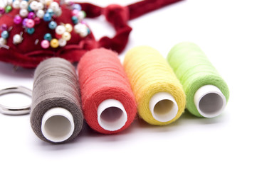 threads for sewing on a white background