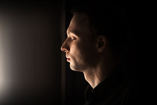 Closeup Profile Portrait Of Young Caucasian Man With Closed Eyes