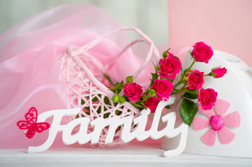 Pink flowers and family decor sign