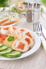 Delicious chicken roll on plate on table close-up