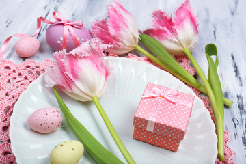 Easter table setting with tulips and eggs