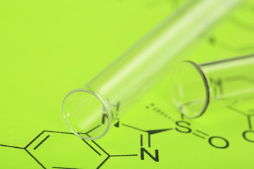 Test tubes and reaction formula, close-up