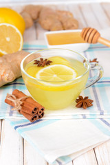 Healthy ginger tea with lemon and honey on table close-up