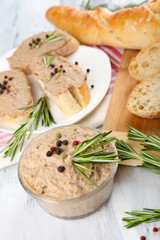 Fresh pate with bread on wooden table