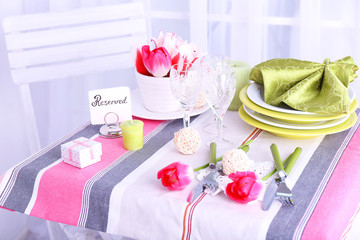 New table with place settings on light background