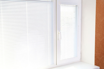 White window with blinds