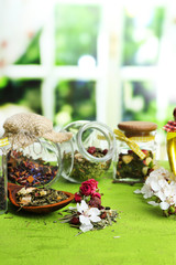 Assortment of herbs and tea in glass jars