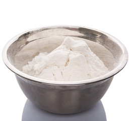 Flour in mixing steel mixing bowl.