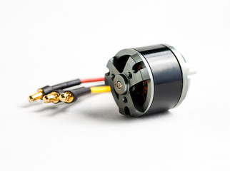 Small electric motor and wires on white