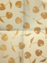 White vintage wrapping paper with gold cherries