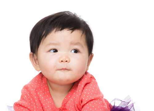 Asian baby girl looking aside