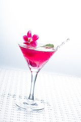 Cocktail with caviar and flower petals