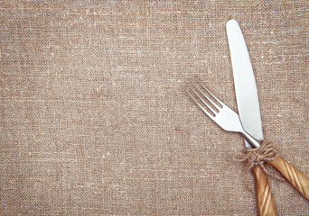 Fork and knife on the burlap