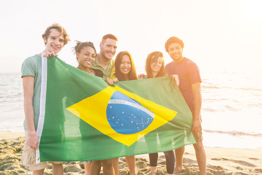 Group of Friends with Brazilian Flag at Beach