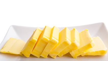 Fresh butter slices in a row