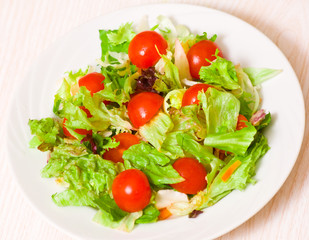 fresh mixed salad leaves with cherry tomatoes