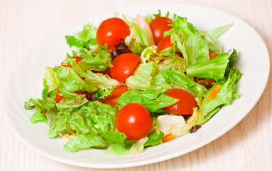 fresh mixed salad leaves with cherry tomatoes