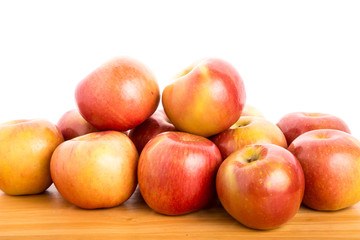Naklejka na ściany i meble Fresh Red Apples on a Wood Table with White Background