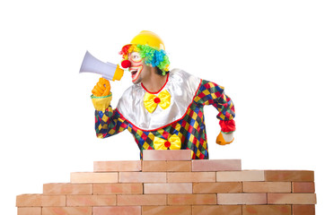 Bad construction concept with clown laying bricks