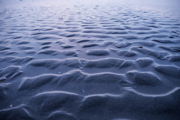 gewelltes muster am strand