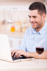 Surfing the net in the kitchen.