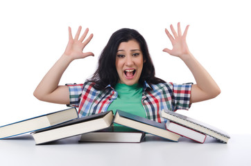 Tired student with textbooks on white