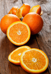 Group of oranges on a wooden table