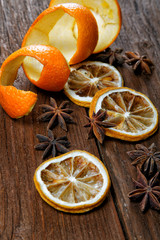 Dried peel of an orange and spice on a table