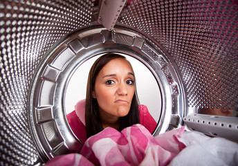 Young woman doing laundry