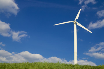 Fototapeta premium Wind turbine against a summer sky