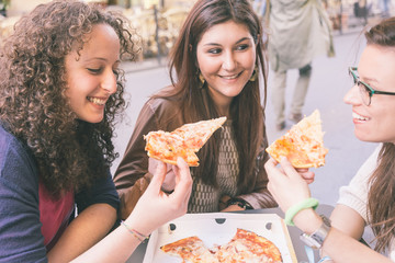 Girls Eating Pizza in the City