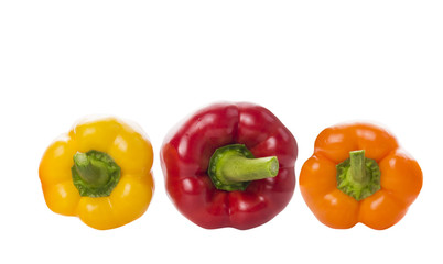 Tricolor paprika peppers , top view, isolated on white