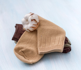 Fototapeta na wymiar Cotton socks with a sprig of cotton.