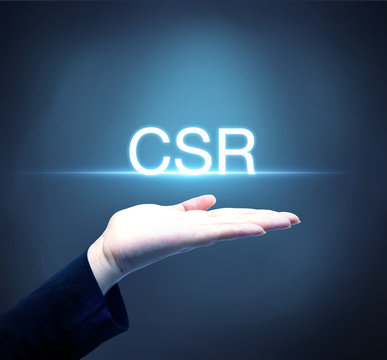 Business person raising hand with CSR concept