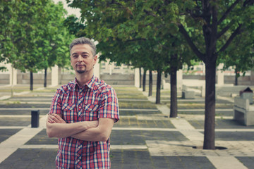 Fototapeta premium Man in short sleeve shirt standing in the street