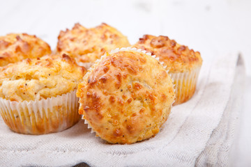 Savory cheese and bacon muffins on the white table