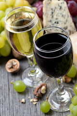 red and white wine, grapes, walnuts and cheeses