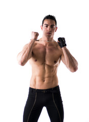 Fototapeta premium Muscular shirtless young man with handcuffs and studded glove
