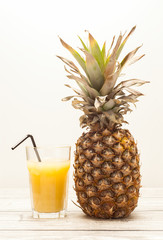 Pineapple on wooden board
