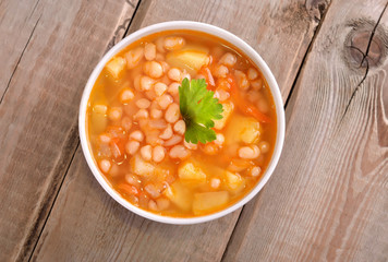 Bean soup on wooden table