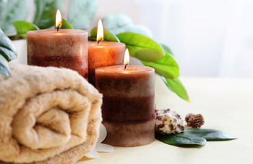 relaxing spa with candles and towels