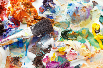 palette with strokes of oil paints