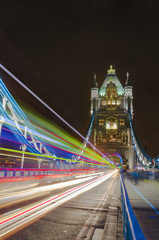 Tower Bridge in London, UK at night with moving light traces