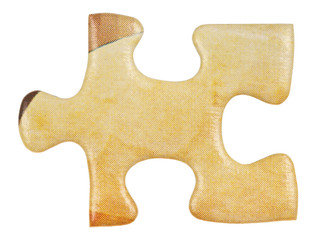 cardboard yellow piece of jigsaw puzzle close up