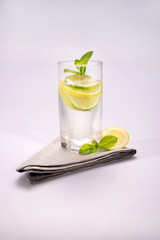Glass of water with mint lime and lemon