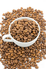 Cup filled with coffee beans