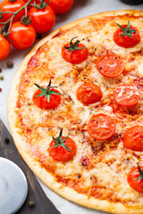 Vegetarian pizza with cherry tomatoes